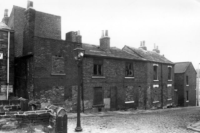 Part of Woodhouse Cliff is on the left, moving right is Ebury Street. The houses are derelict and ready for demolition. Pictured in