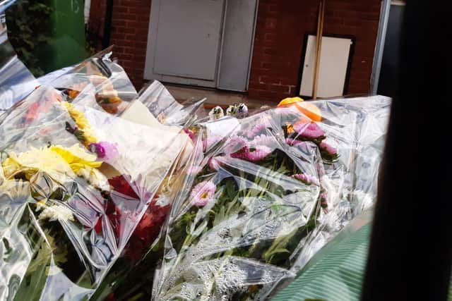 Floral tributes at the scene. PIC: Charles Gray