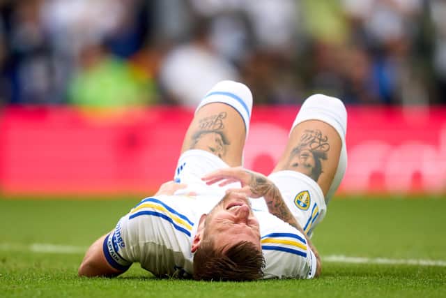 POSITIVE THINKING: From Leeds United Liam Cooper who has revealed initial fears that his injury suffered against Cardiff City, above, was actually much worse. 
Photo by Alex Caparros/Getty Images.