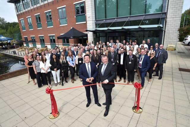 HBF CEO Neil Jefferson cuts the ribbon to Trueman House with Harron's Group Managing Director, James Poynor