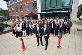 HBF CEO Neil Jefferson cuts the ribbon to Trueman House with Harron's Group Managing Director, James Poynor