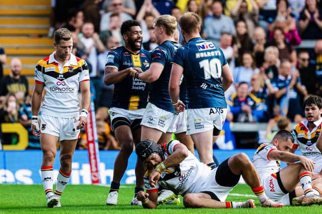 James McDonnell, middle, congratulates Kallum Watkins on his try for Leeds Rhinos in their win against Bradford Bulls. Picture by Alex Whitehead/SWpix.com.