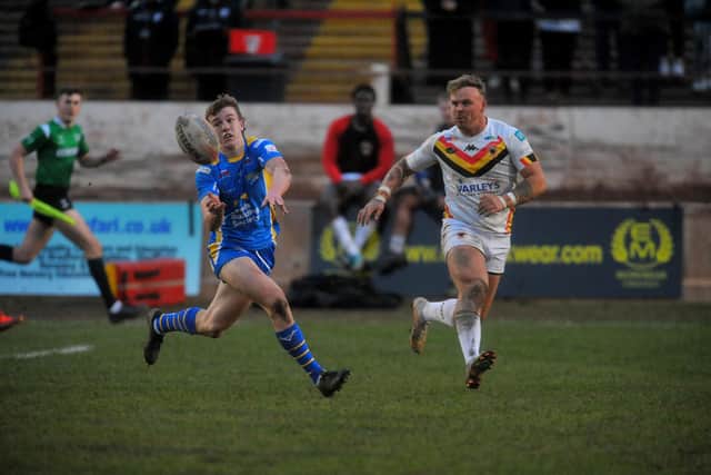 Fergus McCormack gets a pass away during Leeds Rhinos' pre-season defeat at Bradford Bulls. Picture by Steve Riding.