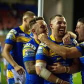 Richie Myler, Cameron Smith and James Bentley celebrate at full-time in Rhinos' semi-final win over Wigan. Picture by Bruce Rollinson.