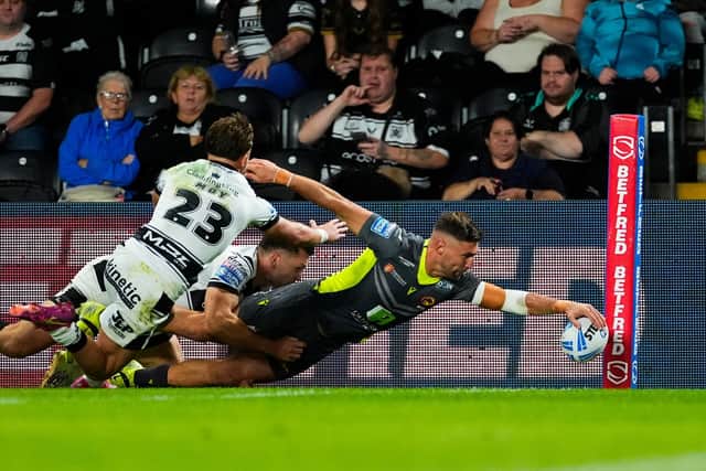 Tommy Makinson scores for Catalans Dragons in their win at Hull FC. Picture by Olly Hassell/SWpix.com.