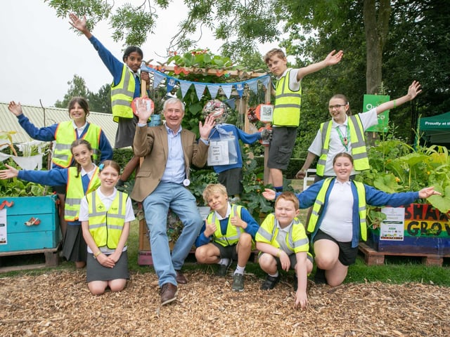 Peter Wright with children from Richard Taylor Church of England Primary School during a visit to the Primary Schools Veg Box Competition