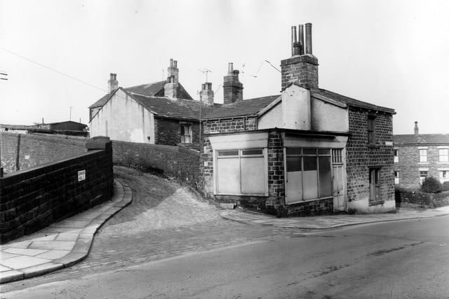 To the left is Dunkirk Hill, at the corner with Canal Road is a former shop, number 79 Canal Road. To the right is 81 Canal Road. Pictured in February 1961.