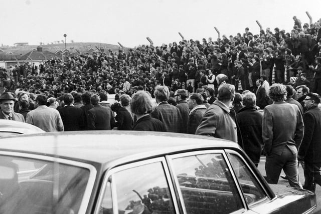 The Spion Kop gang, congregate on the embankment outside in the car park, to jeer the referee as he leaves Elland Road in April 1971. The Divison One clash against West Bromwich Albion finished 2-1 to the visitors.