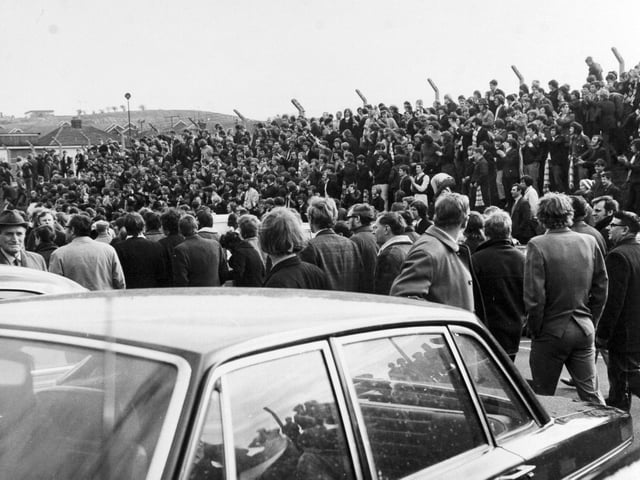 The Spion Kop gang, congregate on the embankment outside in the car park, to jeer the referee as he leaves Elland Road in April 1971. The Divison One clash against West Bromwich Albion finished 2-1 to the visitors.