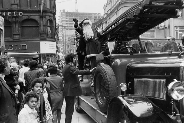 Father Christmas arrived at the Matthias Robinson store in Leeds city centre aboard a veteran fire engine in November 1972.