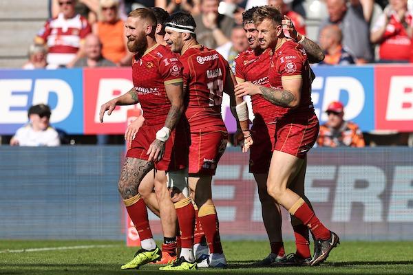 Former Wakefield Trinity winger Tom Johnstone, right, celebrates one of his three tries in the 46-22 Magic Weekend win over Wigan Warriors which took Catalans Dragons top of Betfred Super League.
