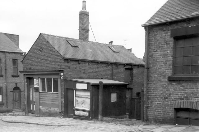 A View of fish and chip shop at number 17 St Luke's Road on the left with opening times displayed. A fish and chip shop was here as early as 1899. Next to it are the tiny premises of Bill's Hairdressing Saloon that "Craven 'A' will not affect your throat". Number 12 Camden Street can be seen far left of photograph.
