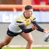 Jacques O'Neill gets a pass away during a testimonial game for his Castleford Tigers teammate Adam Milner at Hull KR in 2021. Picture by Allan McKenzie/SWpix.com.