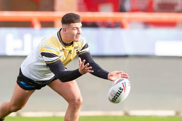 Jacques O'Neill gets a pass away during a testimonial game for his Castleford Tigers teammate Adam Milner at Hull KR in 2021. Picture by Allan McKenzie/SWpix.com.