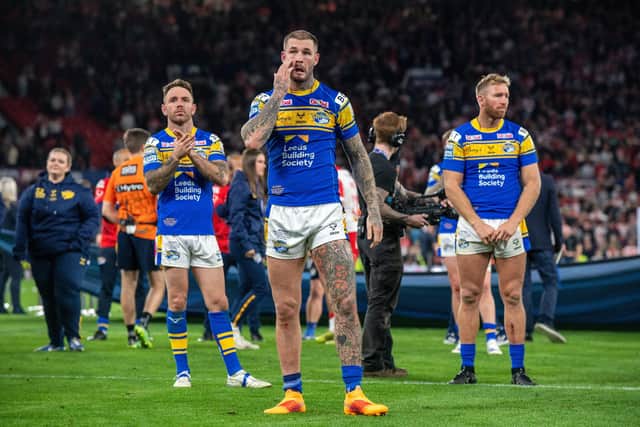 Richie Myler, Zak Hardaker and Matt Prior look dejected as they thank Rhinos' fans after the final whistle. Picture by Bruce Rollinson.