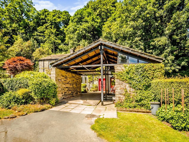 There are three stone outbuildings, along with the car port, that have been used as a workshop, kiln room and storage.