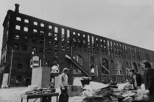 All that remains of the office effects from the fire gutted warehouse on Marsh Lane in July 1974. Pictured are employees of National Carriers Ltd., who had an office in the building.
