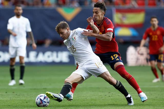 DEFENSIVE WORK: Put in by Leeds United forward Rodrigo, right, for Spain, the Whites star pictured challenging Italy's Nicolo Barella in Thursday night's Nations League semi-final. Photo by KENZO TRIBOUILLARD/AFP via Getty Images.