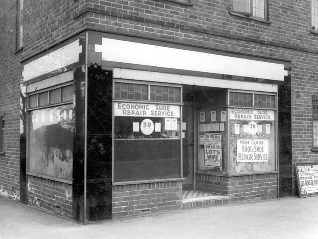Potternewton Lane which was the shoe and boot repair business of Maurice Reuben. To the right of this shop was Perma hairdressing and beyond that Levine's Grocers shop. The three shops were known locally as 'Levine's Parade'. Junction with Blake Grove can be seen on the left. Pictured in June 1939.