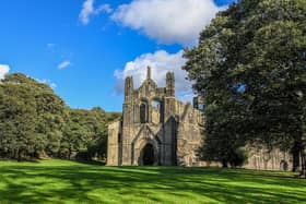 Kirkstall Abbey was founded during King Henry II's reign by a group of Catholic monks, who made a living from keeping sheep near the building for use in the wool trade.
