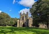 Kirkstall Abbey was founded during King Henry II's reign by a group of Catholic monks, who made a living from keeping sheep near the building for use in the wool trade.