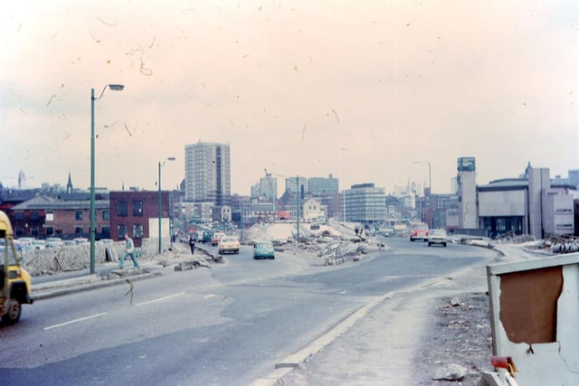 Wellington Street looking in the direction of the city centre at the time of the construction of Stage 3 of the Inner Ring Road, the section from Westgate to Wellington Road. It was completed by February 1975. The clock tower of your Yorkshire Evening Post building is seen near the oncoming traffic to the right. The high rise block in the background is Marlborough Towers.