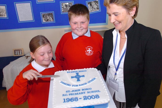 Pupils Sarah O'Connor and Tom Walker help head teacher Anne Mackay to celebrate the school's 40th birthday in this 2008 scene.
