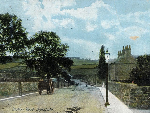 A colour-tinted postcard of Station Road looking towards Horsforth Station and bridge. A horse and cart are seen on the road. With very little development there is a good view of the hills in the background. A date of April 20, 1905 is stamped on the back of the postcard.