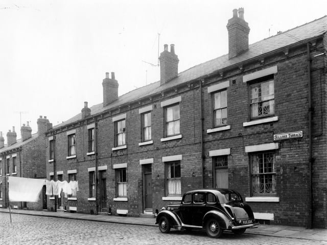 Red brick back-to-back terraced properties situated in Hillidge Terrace in July 1961.