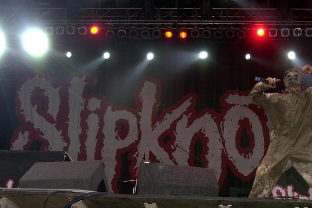 Slipknot on stage at Temple Newsam at the first ever Leeds Festival. The band is well known for its attention-grabbing image, aggressive style of music, and energetic and chaotic live shows.