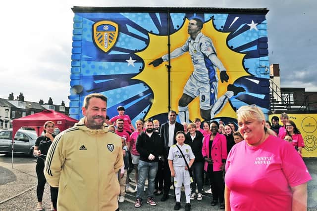 The new Jermaine Beckford mural at Edmund House Club, Pontefract Lane East End Park, Leeds with local youngsters and Saxton FC. At the front is Jonny Nixon, lead coach at Saxton FC session for both Saxton FC and Leeds United Foundation Kicks Programme, and Adele Kendrew, secretary at Edmund House Club. (pic by Steve Riding)