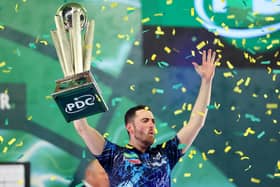 TROPHY PARADE - Luke Humphries lifts the trophy after winning the 2023/24 Paddy Power World Darts Championship final against Luke Littler. Humphries will parade his trophy at Elland Road when Leeds United host Preston North End on Sunday. Pic: Tom Dulat/Getty Images)