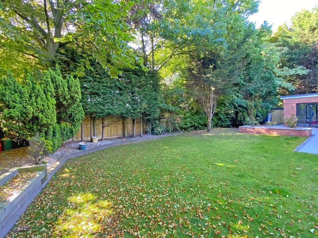 This property has a rear paved garden, with garden room, and an extensive lawned area with patio is bordered with flowers and shrubs.