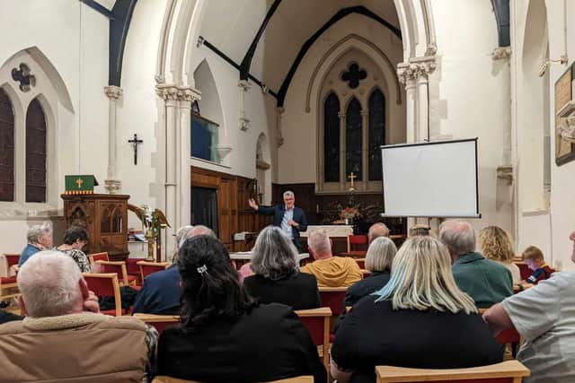 Councillor James Lewis addressing residents about proposed battery farms at St Mary The Less Church in Allerton Bywater on Tuesday (Photo by David Spereall/LDRS)