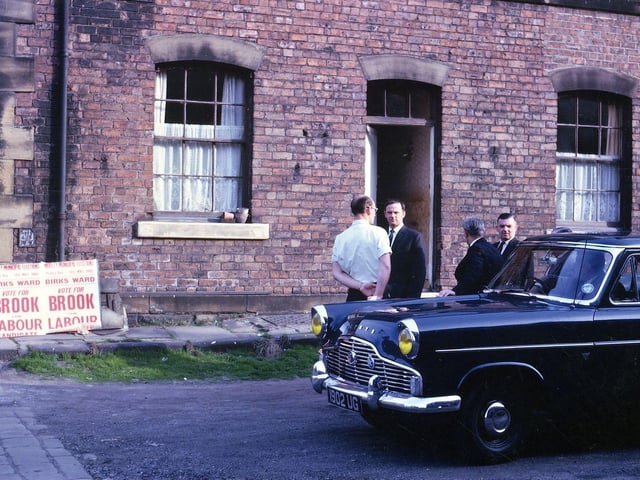 The entrance to Brian Street, close to Bridge Street School polling station. Labour Party workers are canvassing for either Harry Brook or Ken Brook in the Birks Ward. Pictured in May 1965.