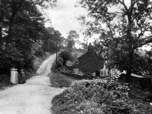 This postcard with a postmark of April 9, 1917 is entitled 'Tay Foot, Adel, Leeds'. This is presumably an old name for Stair Foot as it shows Stairfoot Lane seen from Stairfoot Bridge. The house to the right of centre is Bridge Cottage; a cottage has existed here since at least 1682 when it was marked on a map as being owned by Richard Wrigglesworth, who farmed 36 acres around.