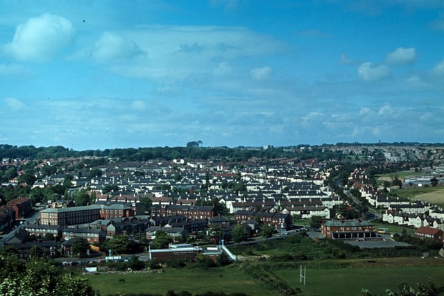 An aerial view of Meanwood from Woodhouse Ridge, looking across a rugby ground and fields towards Grove Lane running along the bottom. The Meanwood Hotel public house is on the bottom right at the junction with Meanwood Road. Bentley Lane runs up on the far left with Bentley Primary School on its right hand side, while Stainbeck Road runs up on the right. Much of the housing in between the two, mainly terraces, has since been demolished and replaced by semi-detached housing. Pictured in June 1973.