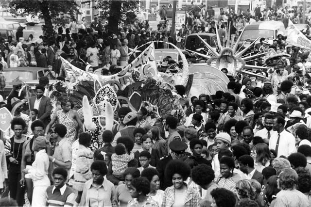 Leeds West Indian Carnival in August 1973. The parade, led by their Carnival Queen, makes its way down Chapeltown Road with thousands of happy followers thronging the roads and pavements.