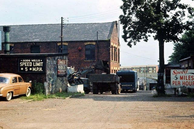 The entrance to Rods Mill along Rods Mill Lane in July 1965. At this time it was in the possession of Sir Harry Hardy who never used it to produce textiles, but had various chemical concerns as offshoots from the woollen industry. The notice Danger - Poison Gas probably refers to the products used in his fumigating service; ammonia and sulphuric acid were supplied to the shoddy industry. As can be seen, the Rods Mill works were overlooked by new housing on the Glen estate.