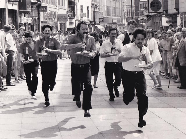 Shopping in Leeds city centre came to a standstill in June 1986 as a group of waiters showed their racing skills. The first ever Leeds waiters' race, a curtain raiser to the Lord Mayor's Parade was started by Miss Leeds Metro '86 Julie Garnett from Commercial Street and finished under three minutes later outside the Bistro Fiori. Mark Hatton, a waiter at the Queens Hotel, was first across the finishing line.