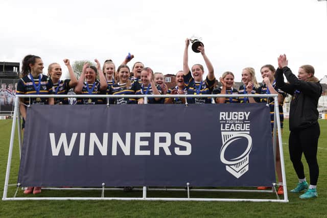 Leeds Rhinos Development Academy celebrate after beating Halifax in the girls' college final at Wakefield Trinity. Picture by John Victor.