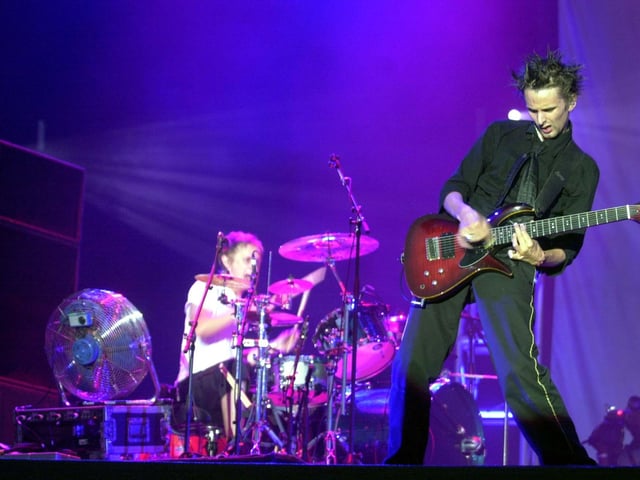 Muse frontman Matthew Bellamy on stage in 2002. They have sold more than 30 million albums worldwide.
