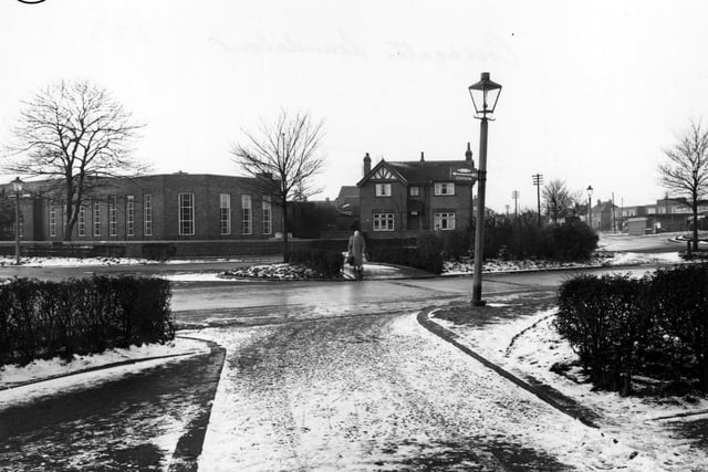 Looking west from Tranquility Avenue across Station Road in January 1956. Crossgates Branch Library can be seen on the left. To the right, next to the library is what appears to be a detached house with a sign over the door, Police Station.