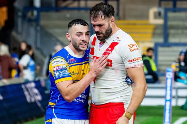 Leeds Rhinos' Jake Connor is consoled by Alex Walmsley, of St Helens, after last year's elimination play-off. Picture by Allan McKenzie/SWpix.com.