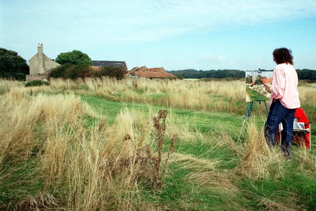 Artist Julie Burdiis from Alice Springs in Australia is pictured working in blues and greens as she paints a Yorkshire landscape at Bridlington's Golf Links in September 1999.