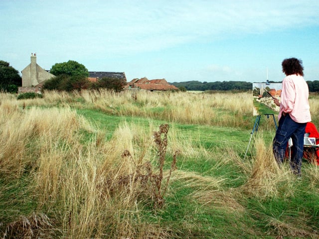 Artist Julie Burdiis from Alice Springs in Australia is pictured working in blues and greens as she paints a Yorkshire landscape at Bridlington's Golf Links in September 1999.