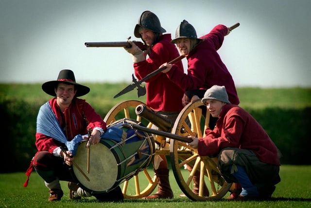 English Civil War Society were ringing the sounds of cannons, muskets, and charging horses during an re-enactment of the Battle of Adwalton Moor in 1643, an important conflict in the Civil War. The event was held at Drighlington Infants School in April 1997. Pictured, from left, are Paul Child, Paul North, Chris Cawthron and Jon Paley.