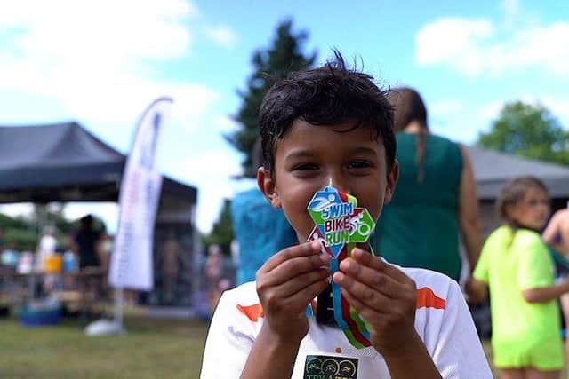 Everyone who participates in Swim Bike Run receives a medal to mark their achievements