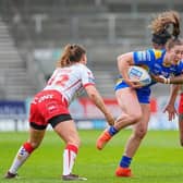Leeds' Ella Donnelly is tackled by Chantelle Crowl during Rhinos' loss to St Helens at TW Stadium on Friday. Picture by Olly Hassell/SWpix.com.