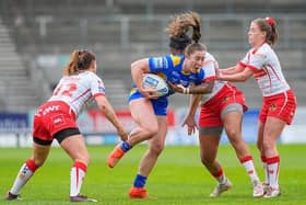 Leeds' Ella Donnelly is tackled by Chantelle Crowl during Rhinos' loss to St Helens at TW Stadium on Friday. Picture by Olly Hassell/SWpix.com.